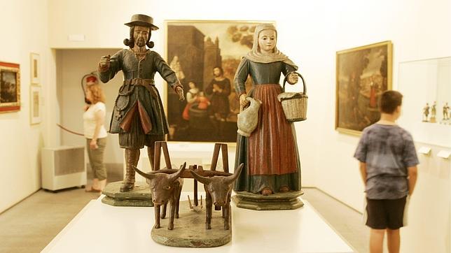 Tallas de madera de San Isidro y su esposa, Santa María de la Cabeza, en el Museo de San Isidro