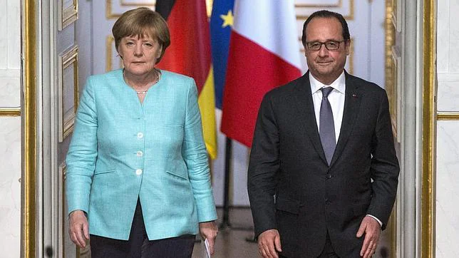 Angela Merkel y François Hollande, tras su encuentro ayer