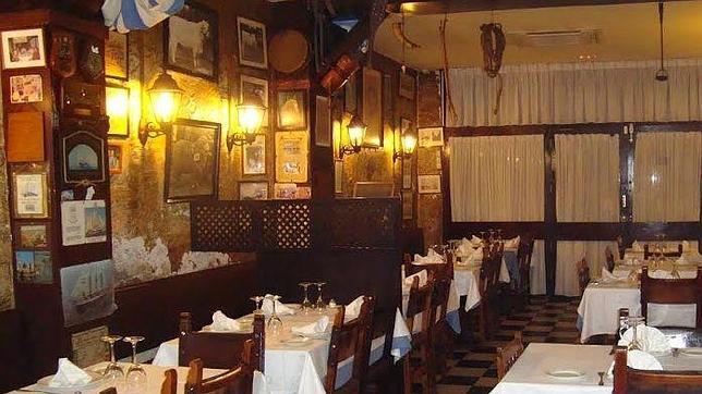 El salón, con sus escrituras en las paredes y sus fotos antiguas
