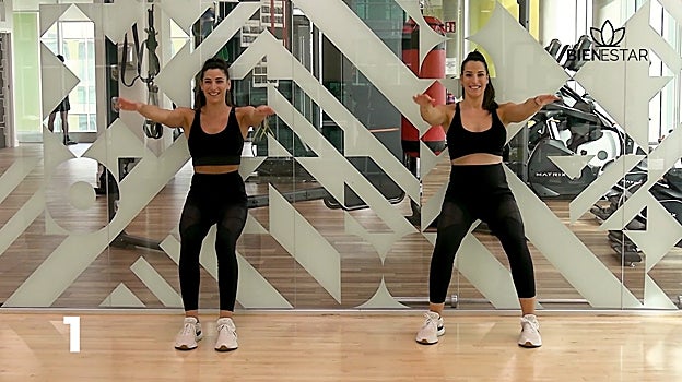 Sentadilla isométrica con rotaciones.