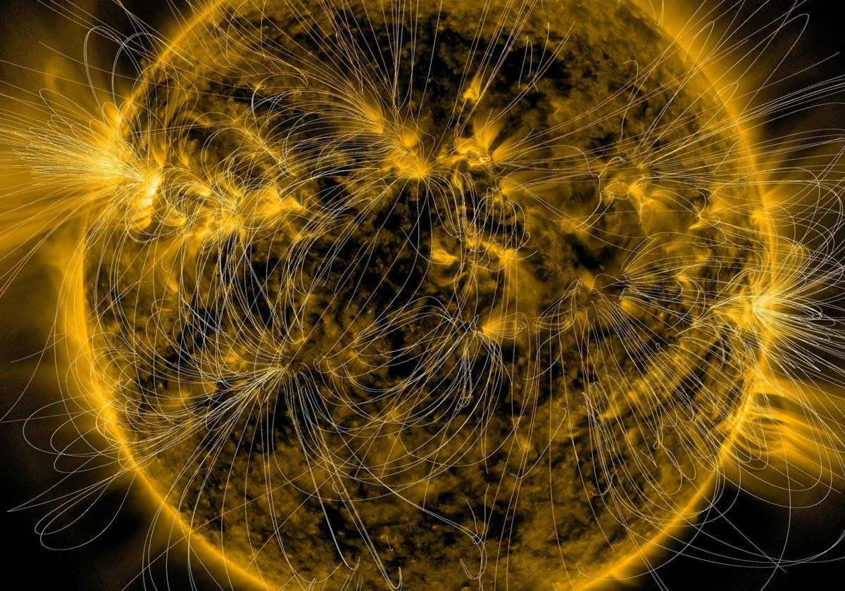 La ilustración muestra los campos magnéticos sobre una imagen capturada por el Observatorio de Dinámica Solar de la NASA