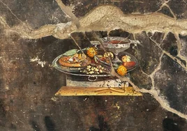 Aparece un antepasado de la pizza en una pintura de Pompeya