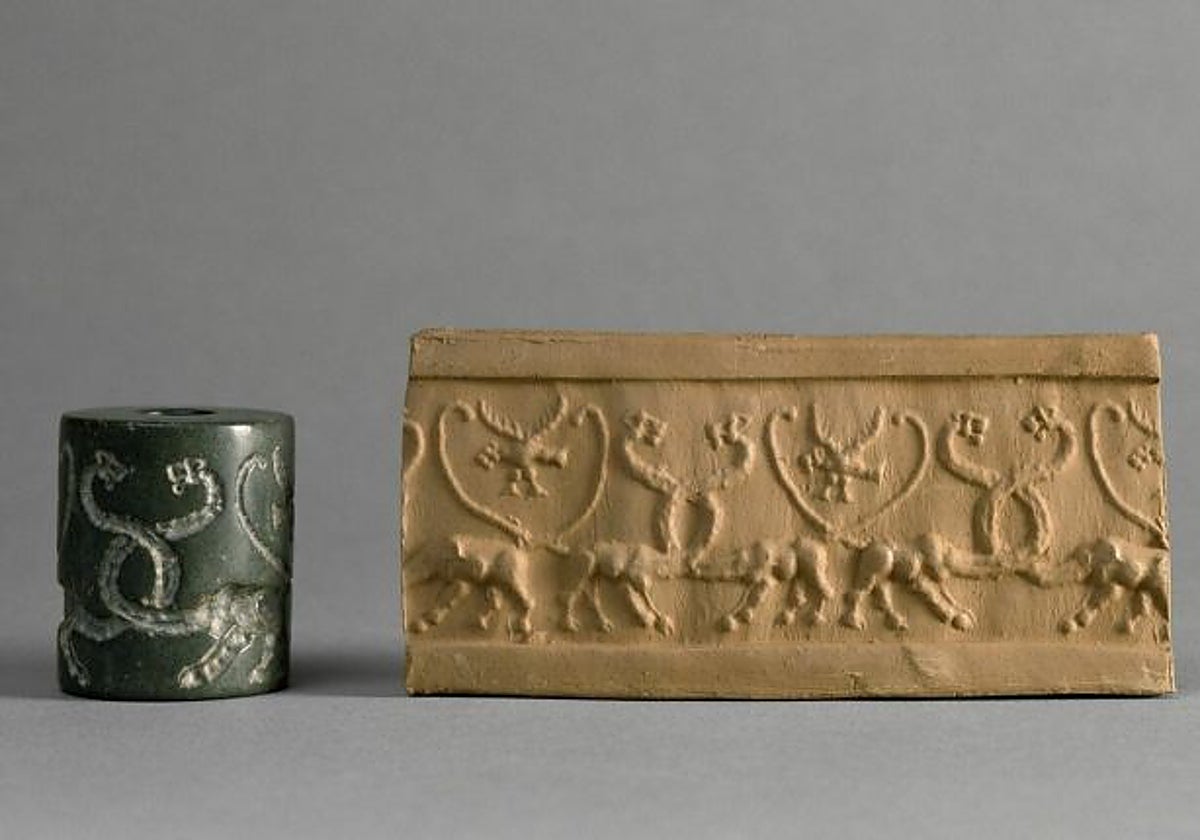Un sello cilíndrico y su diseño impreso en arcilla.