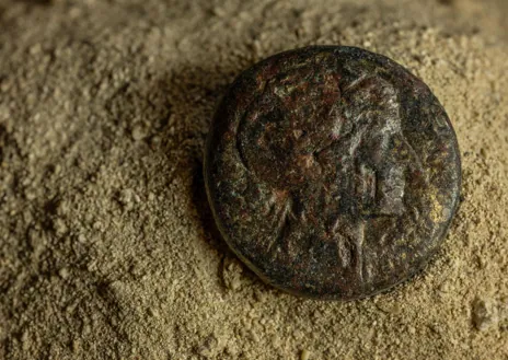 Secondary image 1 - Some of the artifacts found in the latest excavations, a Cleopatra coin and submerged structures