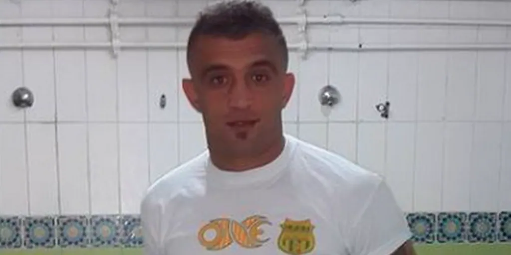 A footballer burns himself after being accused of terrorism