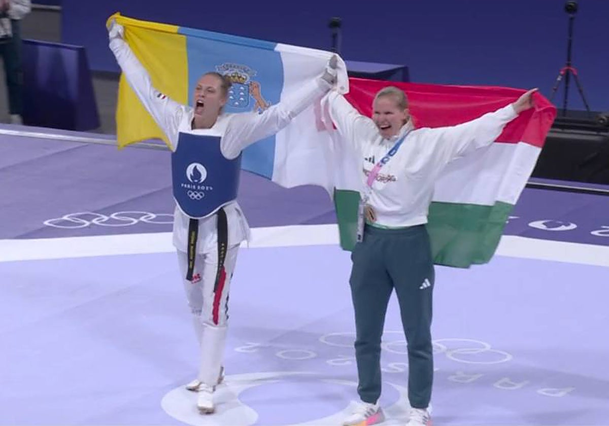 A la izquierda, la húngara Viviana Marton sostiene la bandera de Canarias en la celebración de su oro olímpico