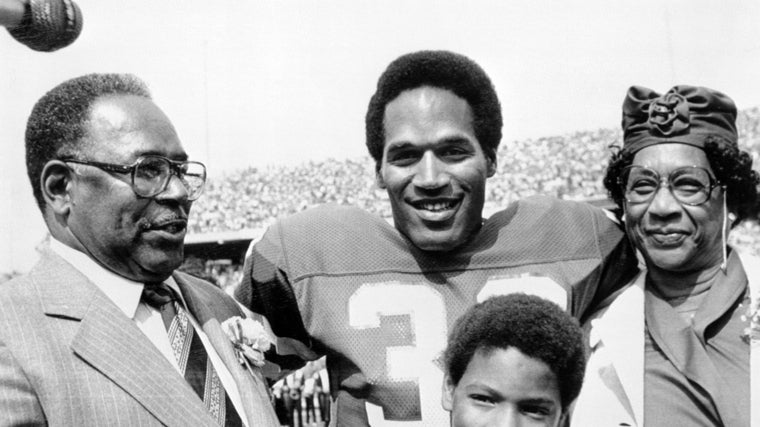 O. J. Simpson, con sus padre y su hijo