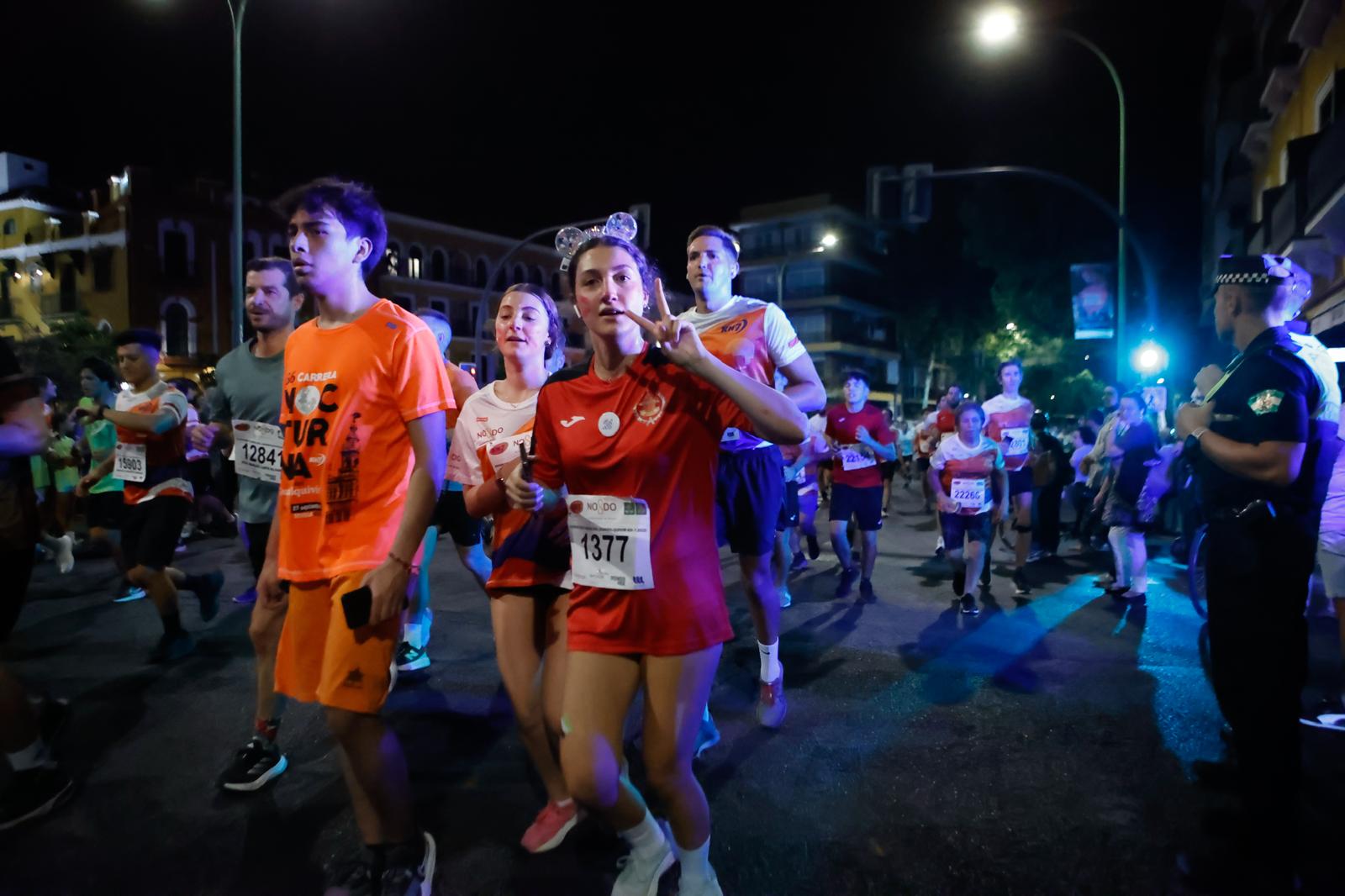 Búscate en la galería de imágenes de ABC de la Carrera Nocturna de Sevilla 2025