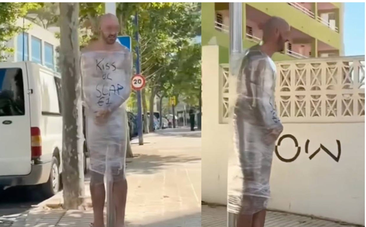 El hombre atado a una señal de tráfico, sin ropa y envuelto en papel film