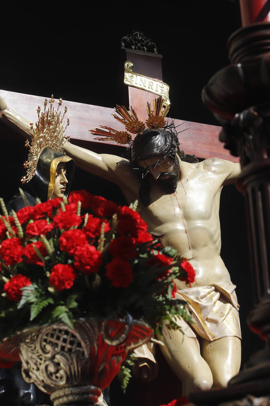 La identidad estética de la Caridad en su estación de penitencia, en imágenes