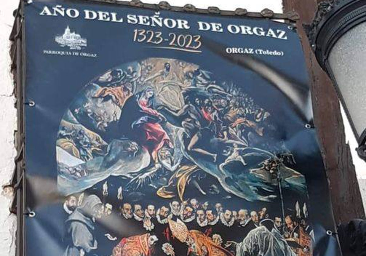 Cartel del Año del señor de Orgaz, en una ventana de la iglesia