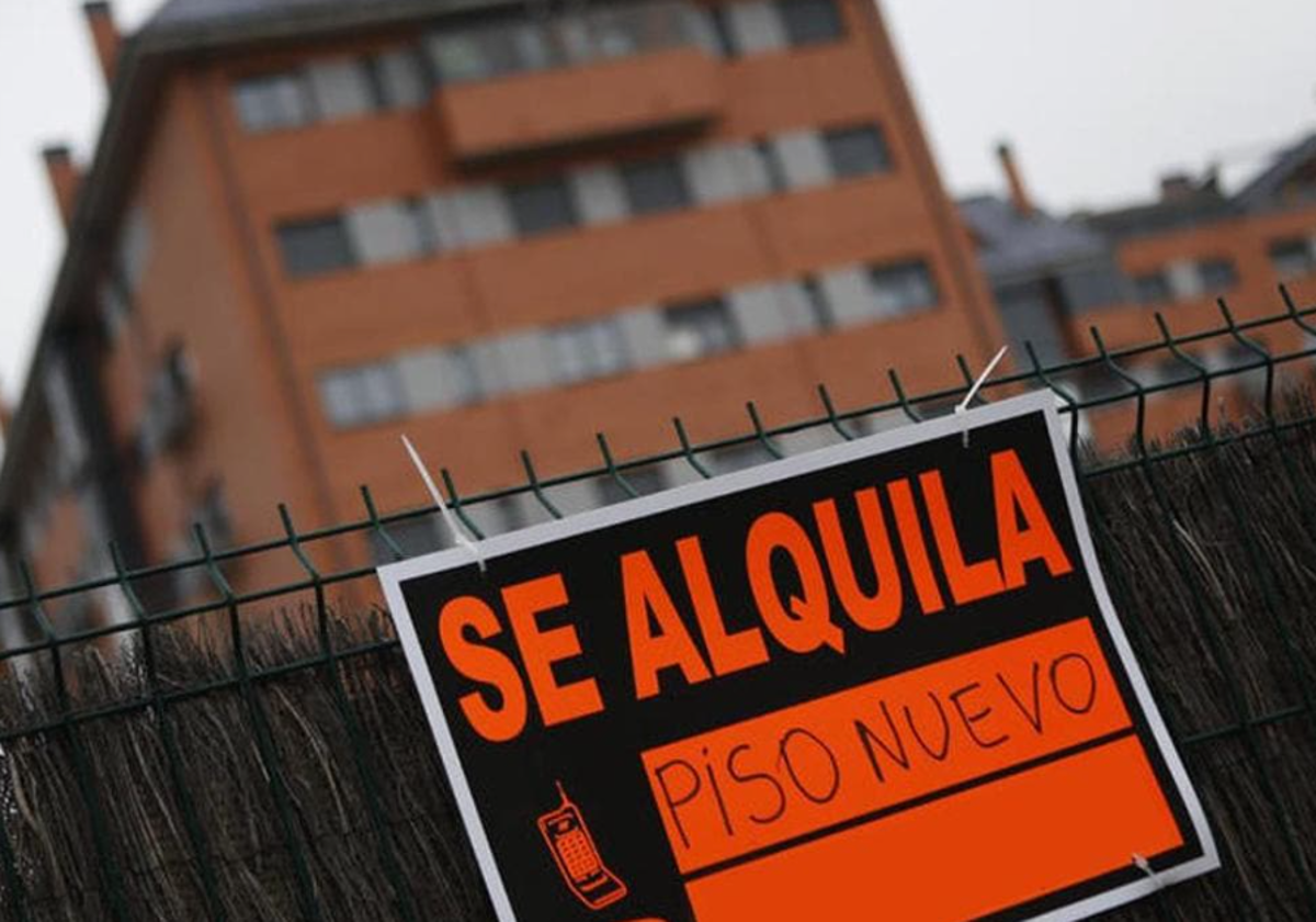 Cartel de piso nuevo en alquiler en foto de archivo
