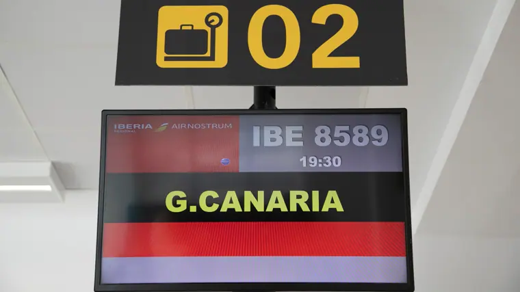 Cartel anunciador de un vuelo a Canarias