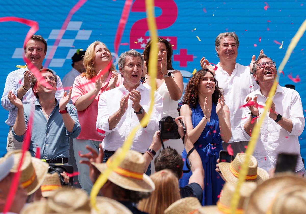 Almeida, Feijóo, Ayuso y Serrano durante un acto en Madrid, este domingo