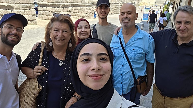 Kayed Hammad, his wife and children walk with friends in Segovia