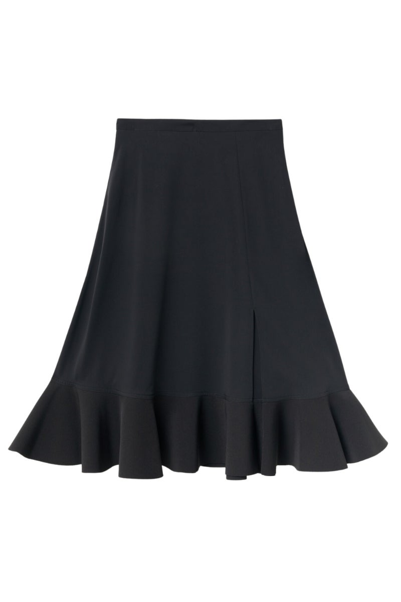 Sfera: falda midi con volante en el bajo y abertura en la pierna. Una pieza atemporal que podrás empezar a lucir este mes y llevar con medias cuando bajen las temperaturas en invierno. Precio: 39,99€.