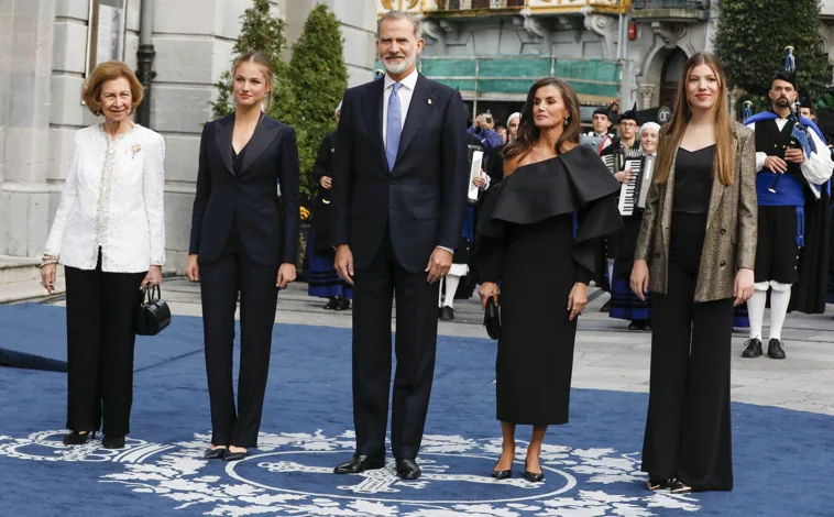 Main image - Doña Leonor, with a black suit and 'messy' updo, at the Princess of Asturias Awards ceremony