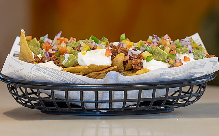 Main image - There are also starters, like these chicken wings, nachos or rib-eye croquettes