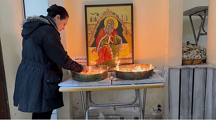 Worshipers go to the Greek Orthodox church in the Dweila neighborhood, under construction due to the June attack