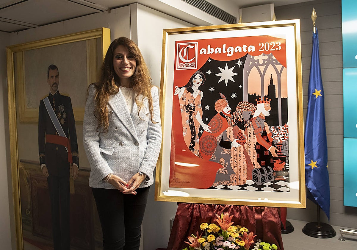 Teresa Guzmán junto al cartel anunciador