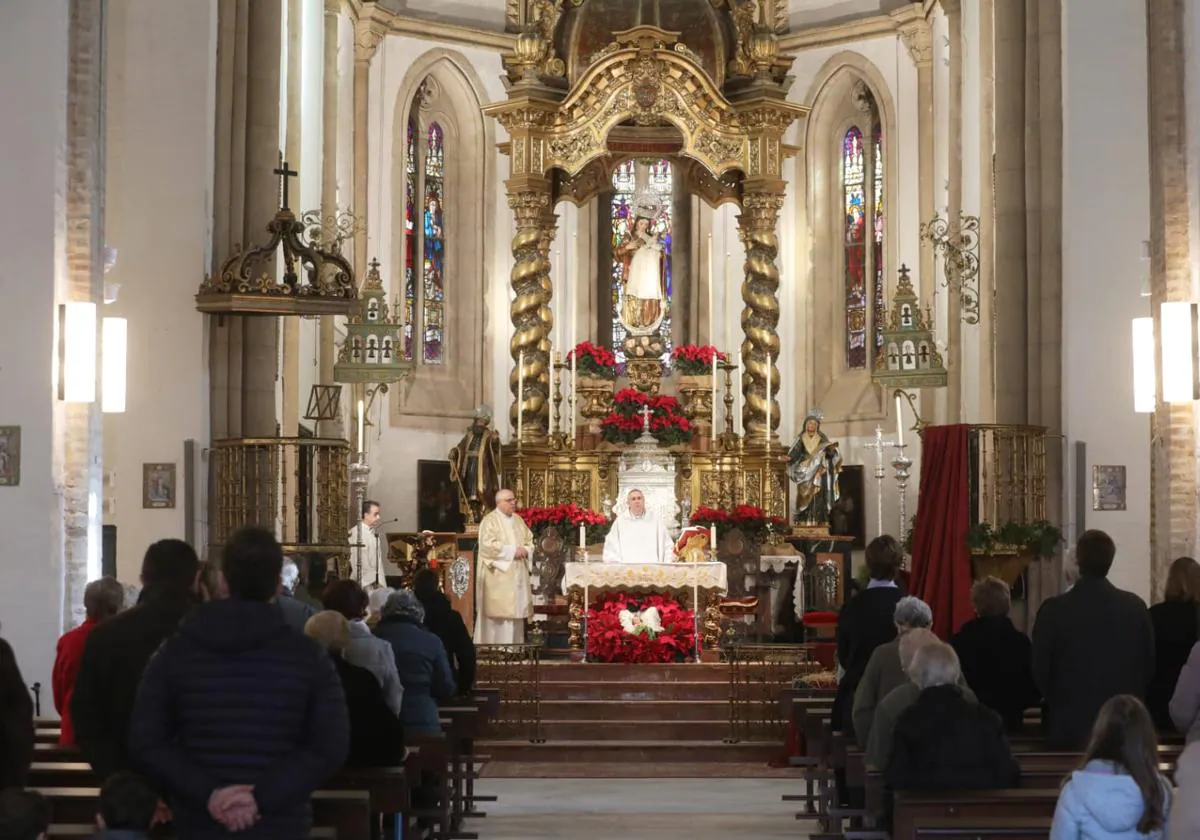 Asistentes de la Misa de Navidad en la parroquia de Omnium Sanctorum