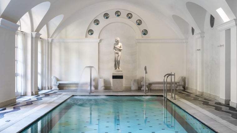 The main pool of the Anantara Villa Padierna spa has views of the gardens with fountains and flowers