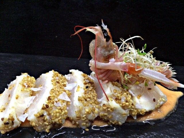 Muesli de corvina marinada y esencia de cigalas