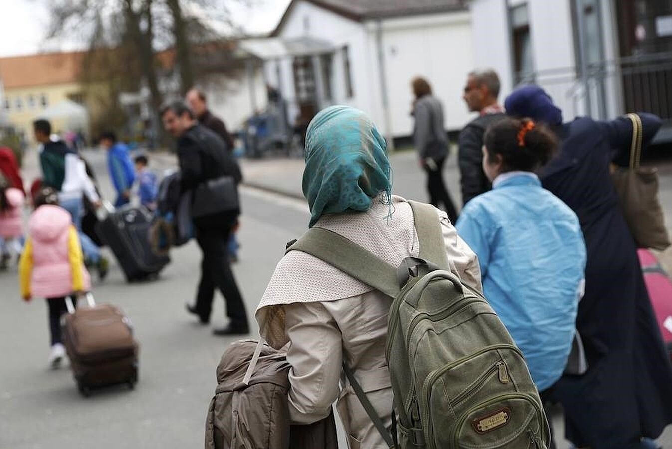 Grupo de refugiados sirios llegados en avión desde Turquía a Alemania, en el marco del nuevo acuerdo