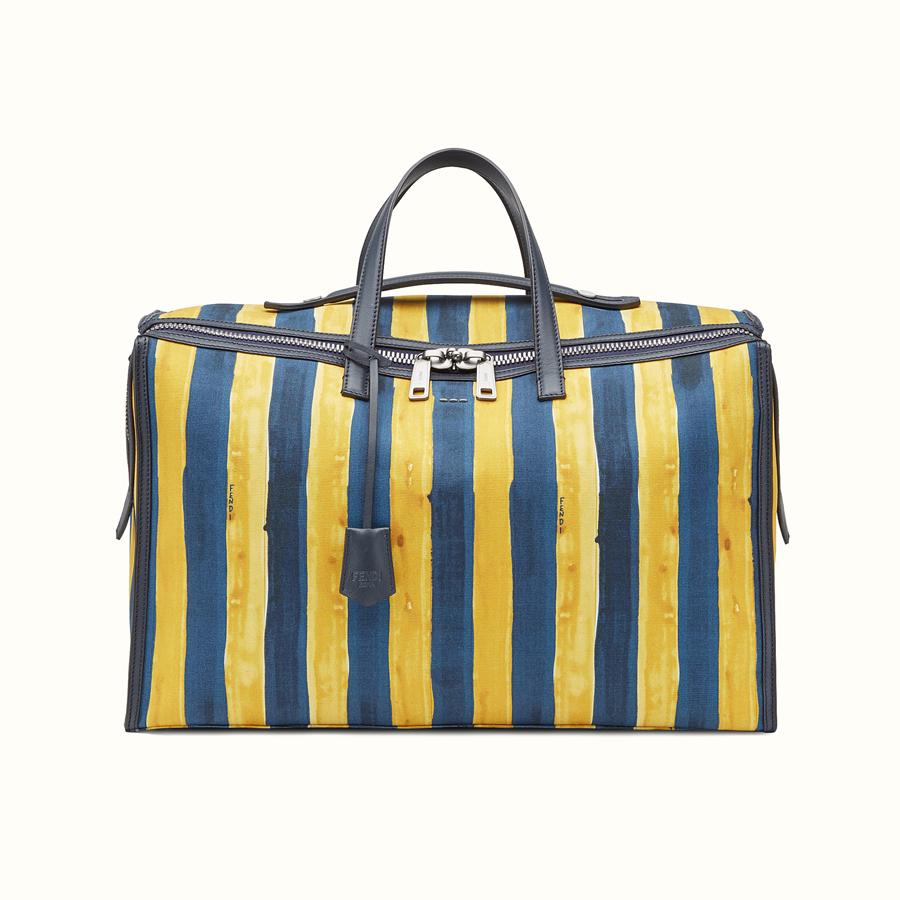 Bolsa de viaje amarilla y azul de lona con detalles en piel (2.500€)