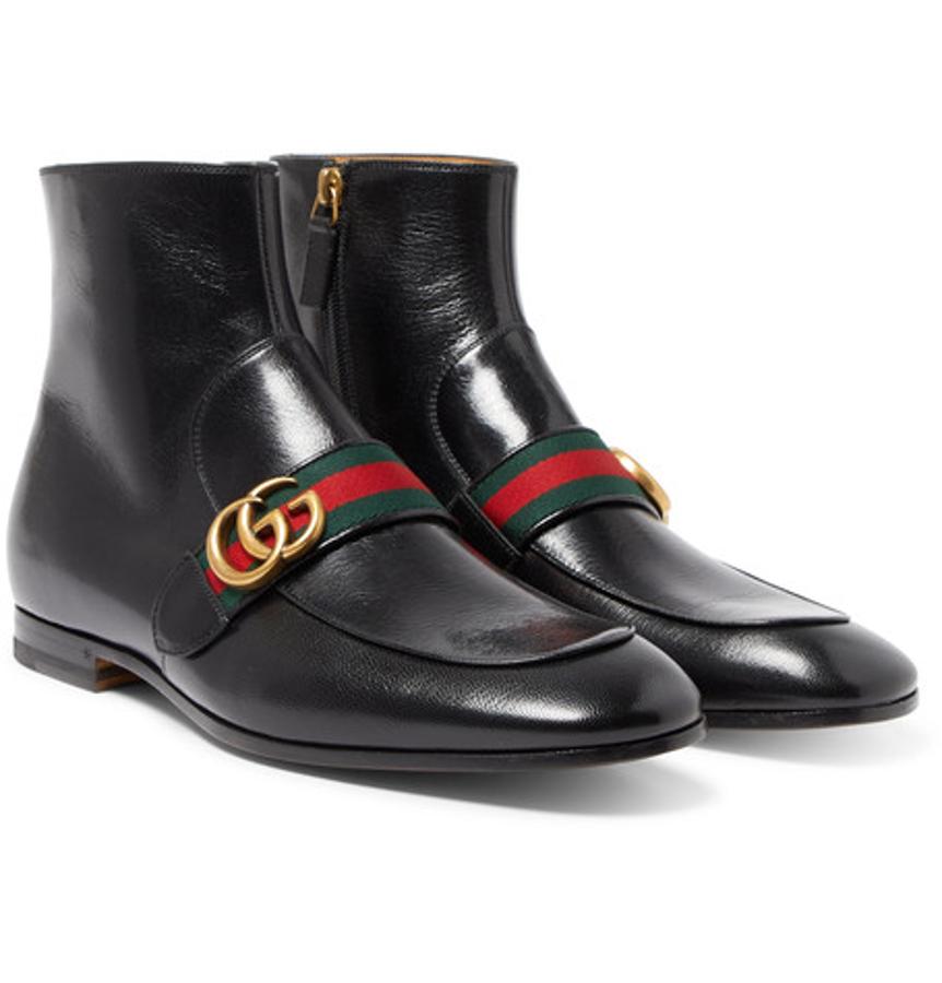 Botines de Gucci. Alessandro Michelle apuesta por el logo de la casa en botines como estos en color negro (Precio: 890 euros)
