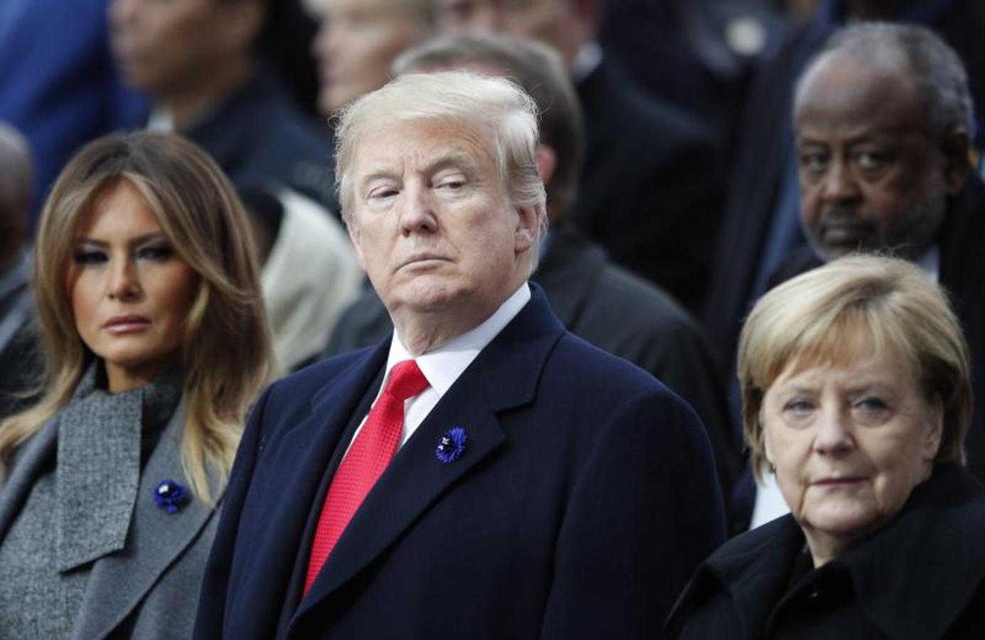 Donald Trump junto a su mujer, Melania Trump, y Angela Merkel