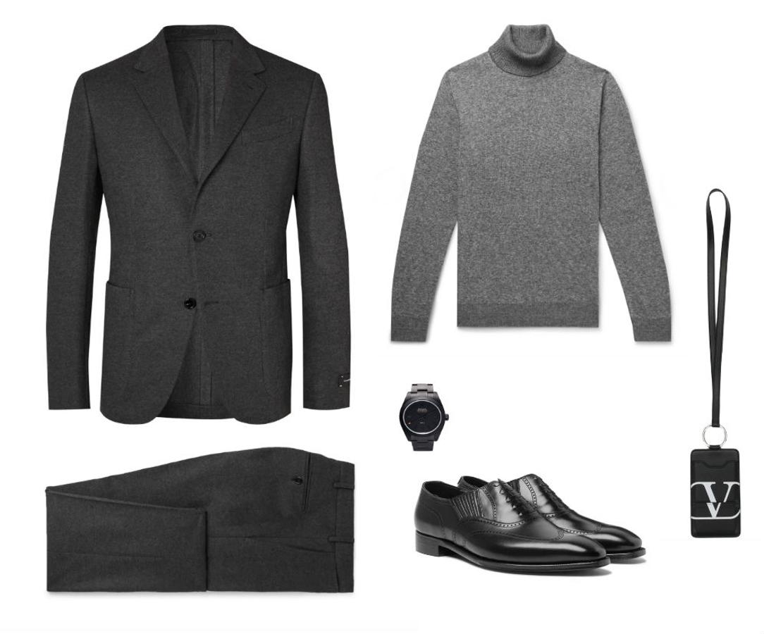 Look de Nochevieja en negro y gris. Los jerséis de cuello alto pueden ser una genial alternativa a la camisa a la hora de llevar traje. Lo mejor para lucirlo es elegir uno de punto fino como este de Loro Liana (precio: 1.300 euros) con un traje de Ermenegildo Zegna (precio: 3.300 euros), unos zapatos negros de George Cleverley (precio: 600 euros), una funda para el móvil de colgar de Valentino (precio: 436 euros) y un reloj de Mad Paris (precio: 28.015 euros).