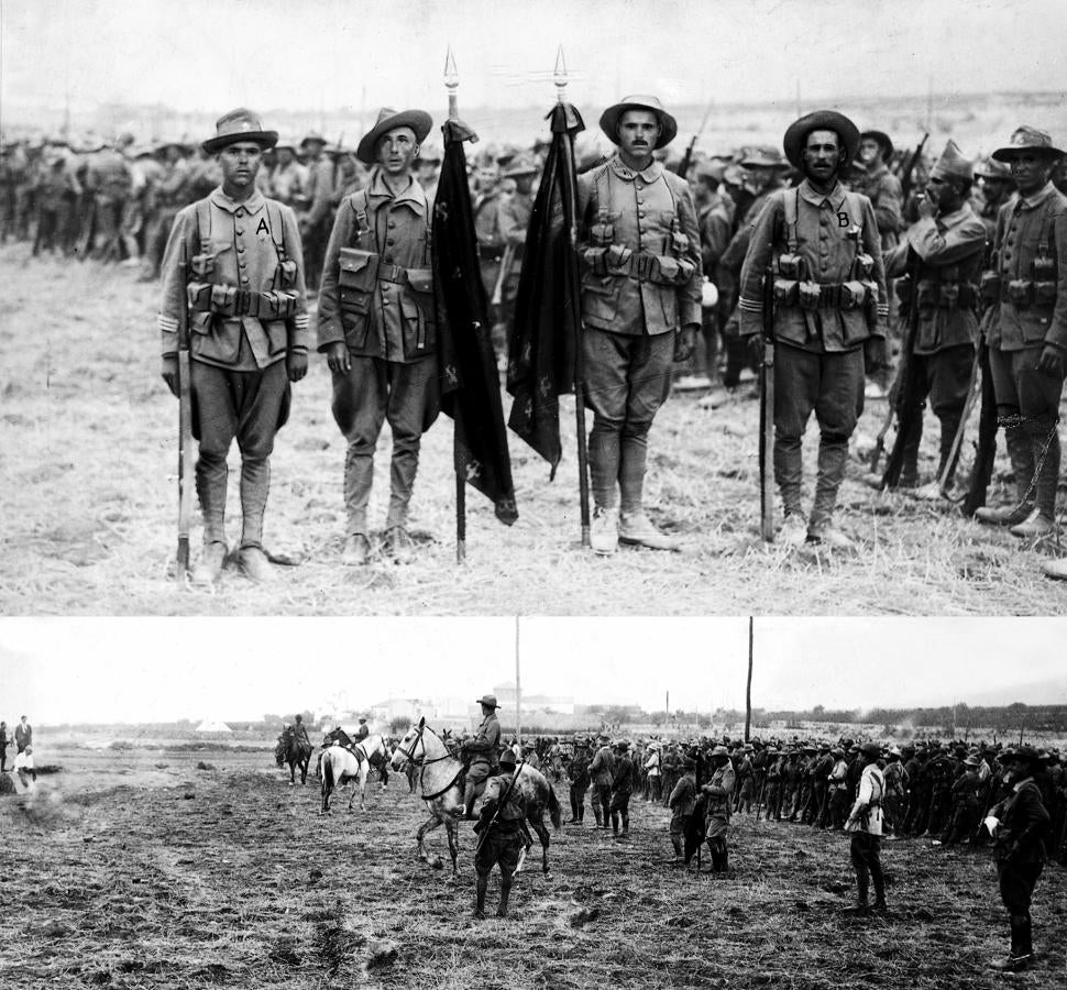 Méritos de guerra. Varios legionarios en el campo de operaciones, acompañados de los abanderados y oficiales revisitando a la tropa en 1921
