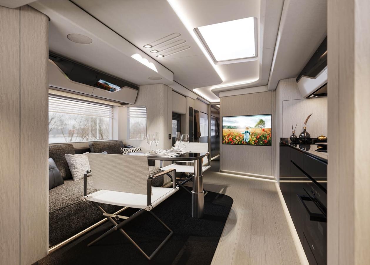 Dembell, la autocaravana inspirada en un yate. La cocina cuenta con electrodomésticos Miele y no falta ni la lavadora ni la secadora, incluso también hay una amplia televisión.
