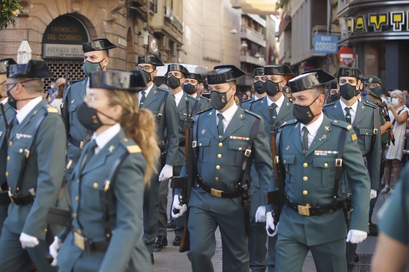 El izado de la bandera de España en los actos de la Guardia Civil por su patrona, en imágenes