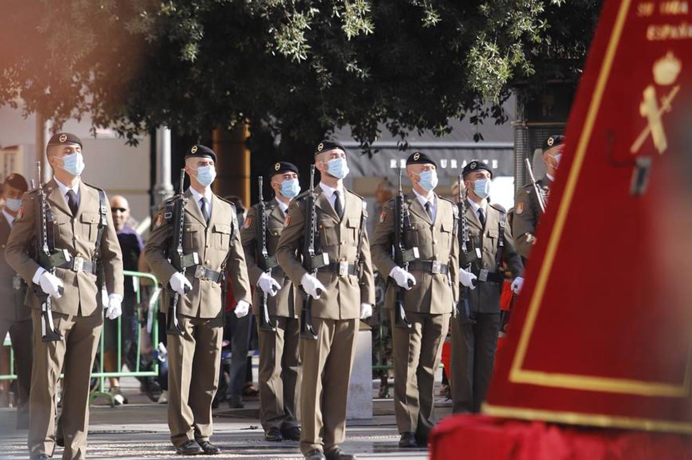 El izado de la bandera de España en los actos de la Guardia Civil por su patrona, en imágenes