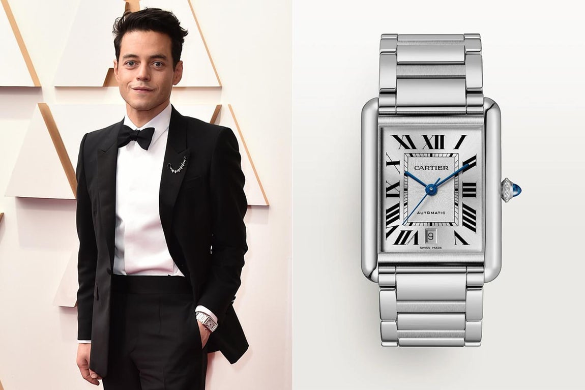 Rami Malek y Cartier. El actor optó por una elegante versión del clásico Tank de Cartier, en tamaño XL este reloj cuenta con movimiento mecánico de carga automática y caja de acero de 41 mm x 31 mm. Con corona perlada decorada con un cabujón de espinela sintética y esfera flinqué plateada, es sin duda uno de los relojes más elegantes cuyo precio de venta actual es de 4.050 euros.