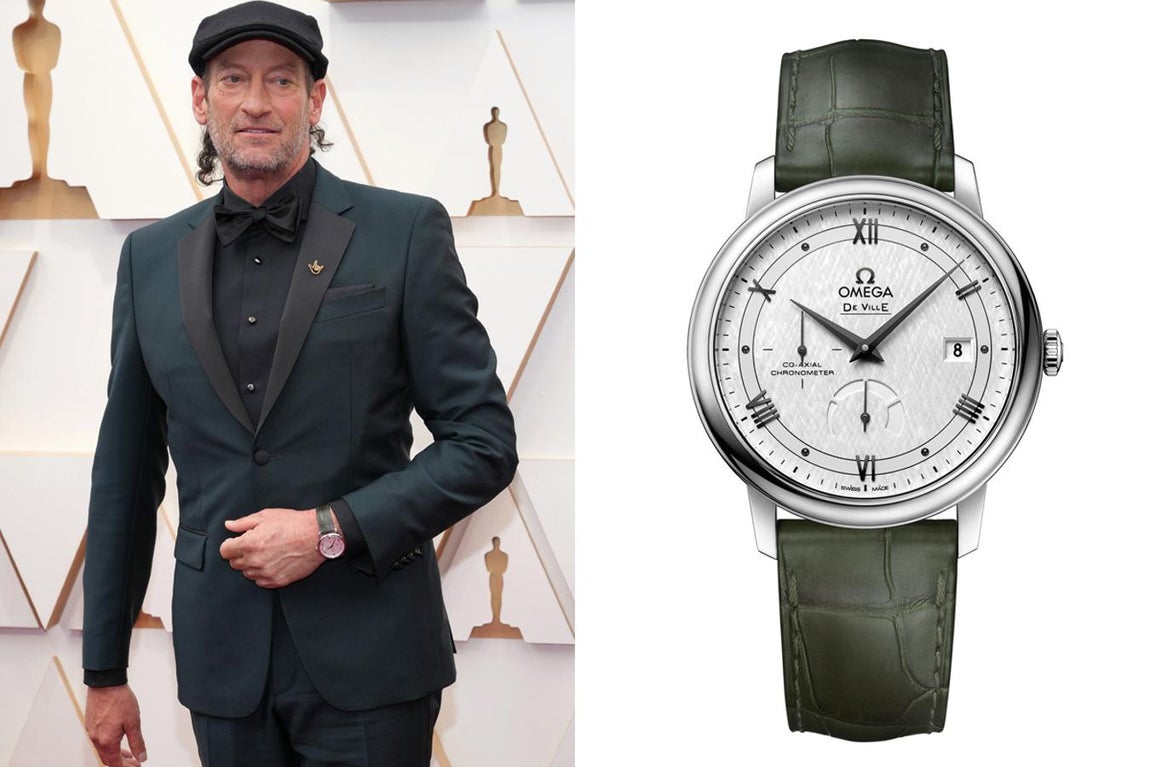 Troy Kotsur y Omega. El ganador del Oscar a Mejor Actor de Reparto por su interpretación en 'CODA' optó por el modelo De Ville Prestige de Omega, un reloj con caja de 39,5 mm, de líneas clásicas y algo minimalista. Este modelo luce esfera plateada blanca con diseño sedoso y acabado opalino. Las agujas están ennegrecidas y los índices horarios incluyen seis cabujones ennegrecidos y números romanos también ennegrecidos. Su precio es de 4.700 euros
