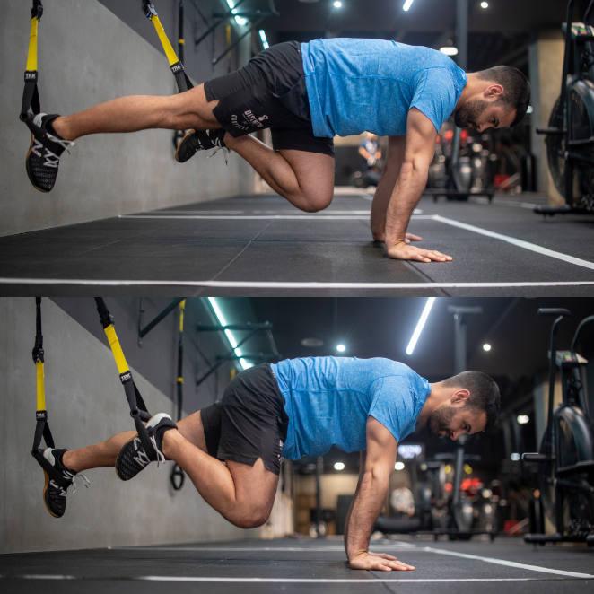 Escaladores. Este ejercicio también sirve para trabajar el 'core'. Tomamos la posición de decúbito prono y metemos los empeines por las cinchas del TRX. A continuación, nos apoyamos sobre las manos con brazos extendidos y elevamos la cadera. Realizaremos flexión de cadera y rodillas alternando las piernas.