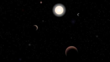 Recreación de un sistema planetario lejano. Las estrellas rojas son más abundantes en la Vía Láctea que las estrellas amarillas, dentro de las que se incluye el Sol