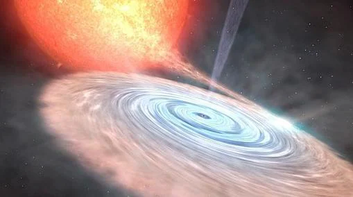 Un agujero negro engulle a una estrella. En la parte de arriba, se forma un jet de gas, emisor de rayos gamma