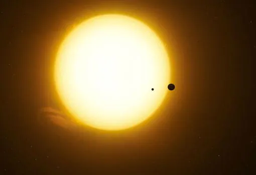Representación de la estrella Kepler-1625 y un exoplaneta, junto a una luna, pasando delante de ella. Esto es lo que parece haber detectado el Hubble gracias a la técnica de los tránsitos