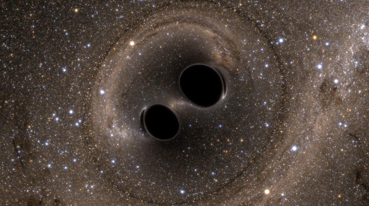 Representación de la fusión de dos agujeros negros, estelares, miles de veces menos «pesados» que los supermasivos