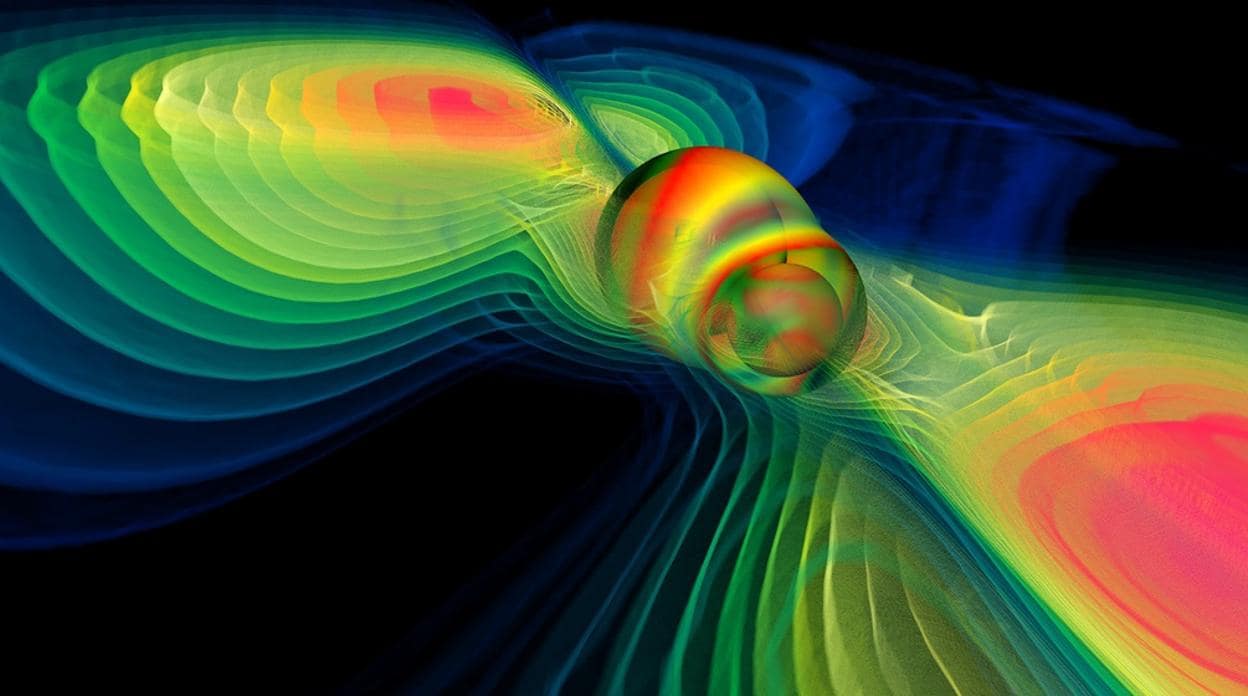 Simulación por ordenador de la fusión de dos agujeros negros y de ondas gravitacionales liberadas