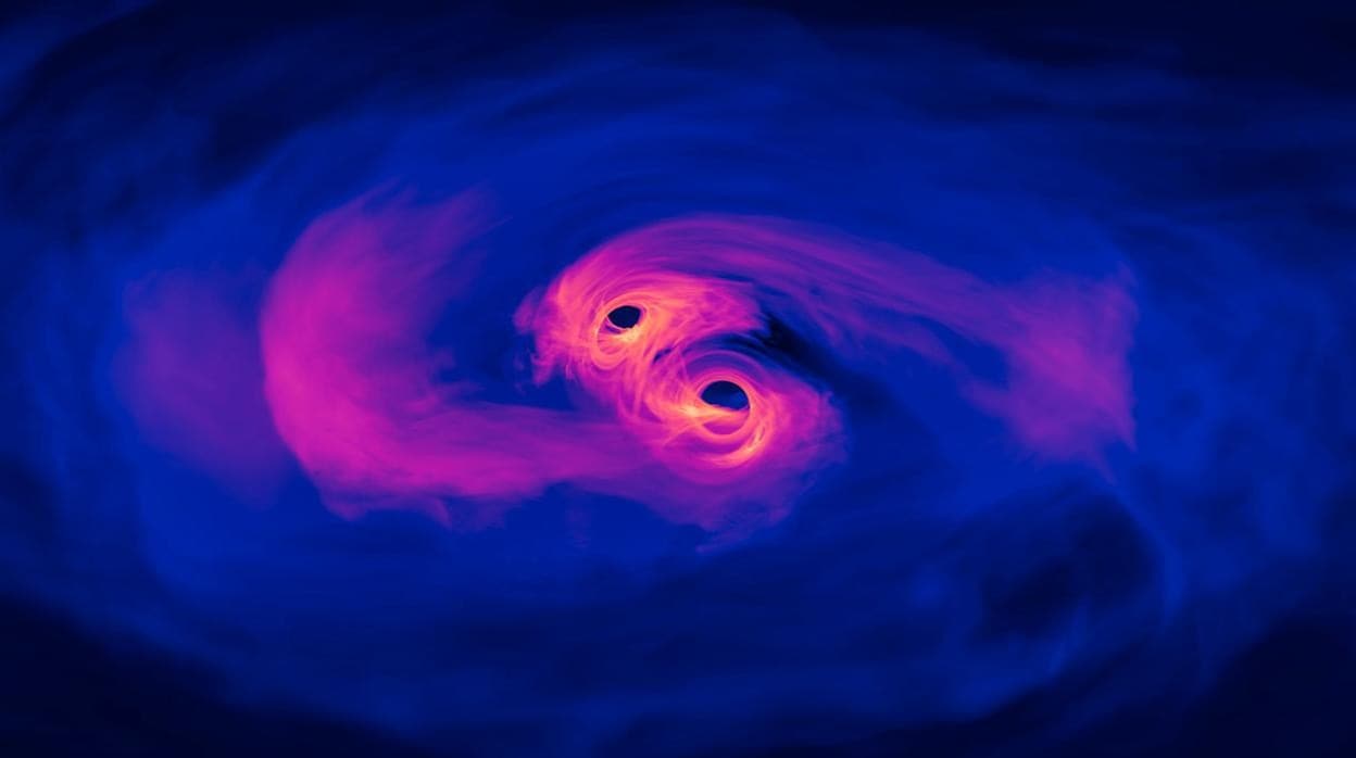 En la imagen, una simulación en la que se aprecia cómo dos agujeros negros supermasivos están a punto de fusionarse