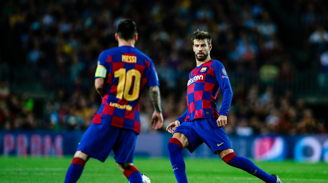 Messi y Piqué durante un partido del Barcelona