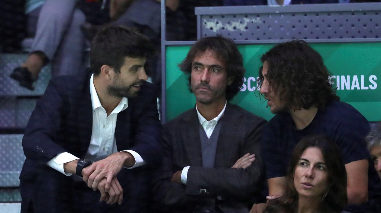 Gerard Piqué y Carles Puyol durante un partido de Nadal en la Caja Mágica