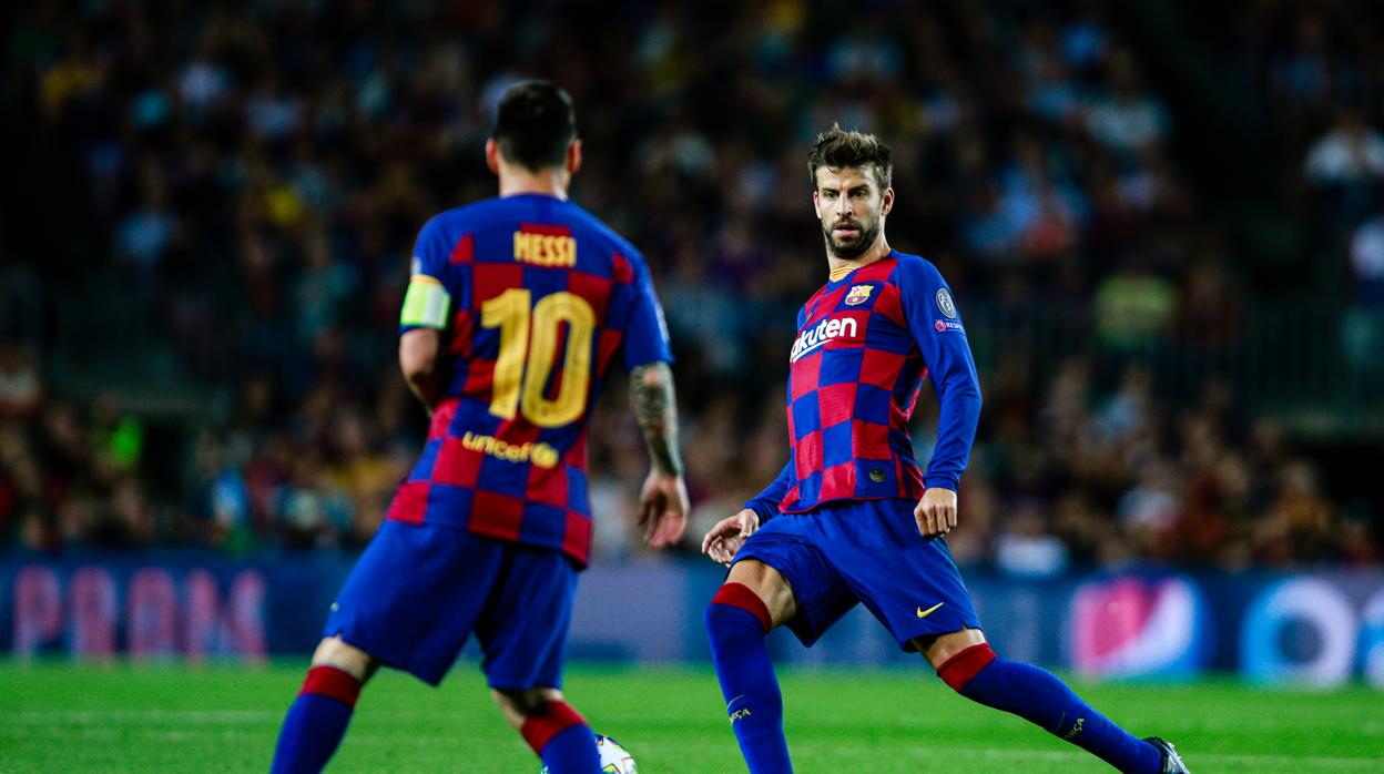 Messi y Piqué durante un partido de la Champions League