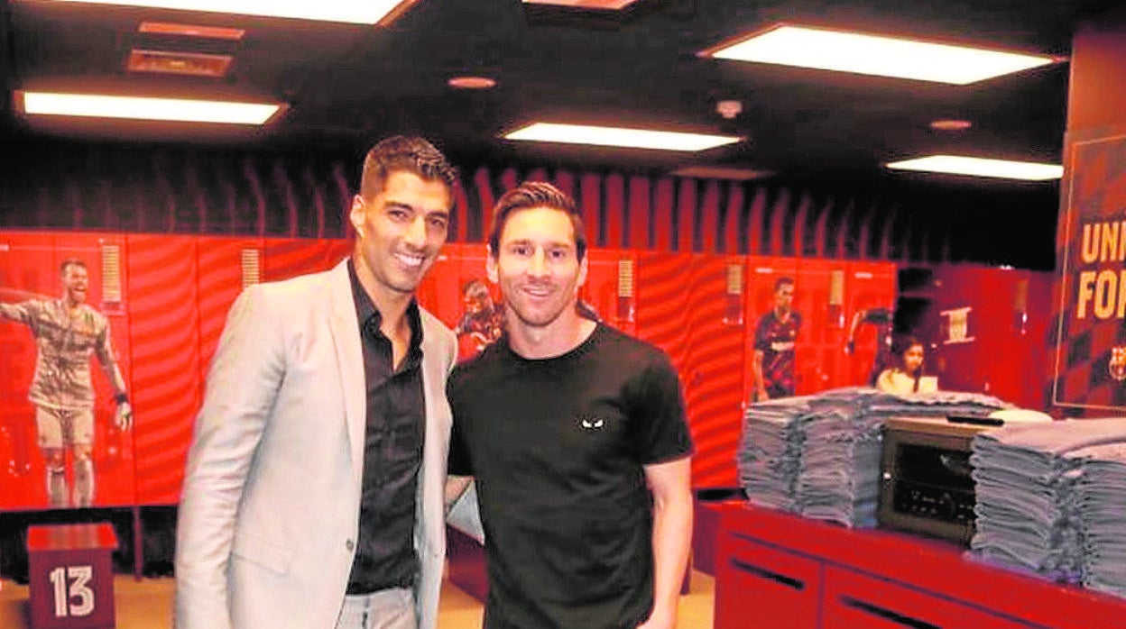 Messi y Suárez, durante un acto promocional del Barcelona