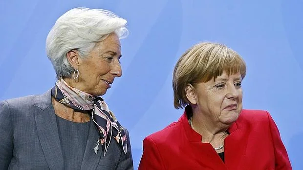 Christine Lagarde, directora gerente del FMI, junto a la canciller alemana, Angela Merkel